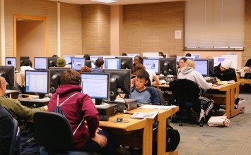 Photo of students in the Course Reserves Section of the Library.